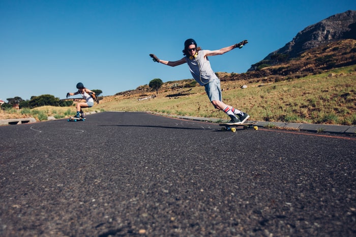 riding electric skateboarding on the road