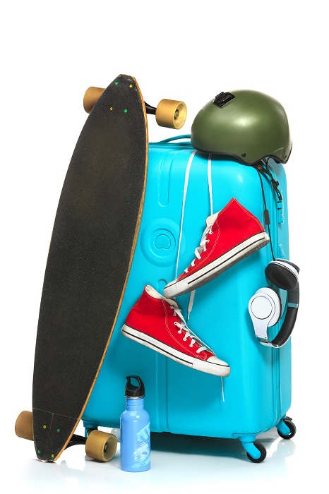 suitcase sneakers skateboard
